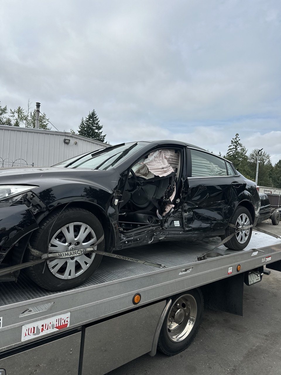 Vehicle loaded on a flatbed after an accident